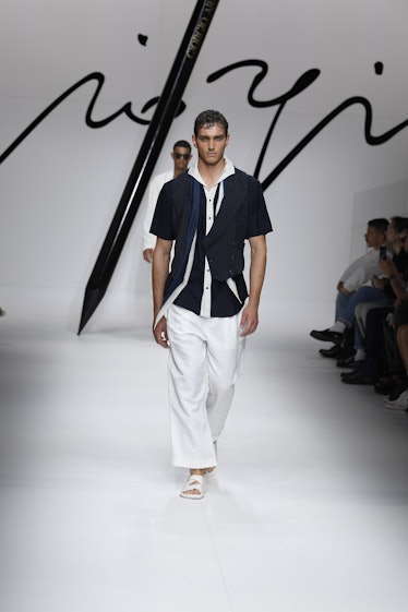 Model on the runway at the Giorgio Armani Spring 2024 Menswear Collection Fashion Show at Armani Hea...