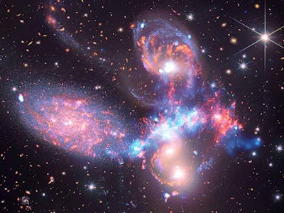 Stephan's Quintet. In this object, five galaxies appear very crowded to one another. In between the ...