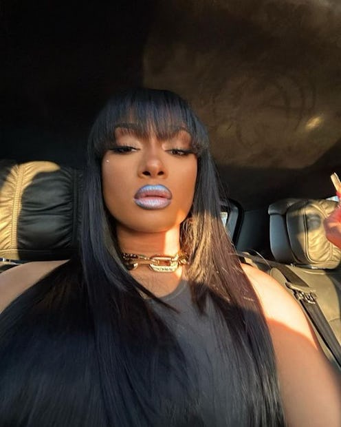 Megan Thee Stallion wore a metallic blue Revlon lipstick combination to Pharrell Williams' 2023 Loui...