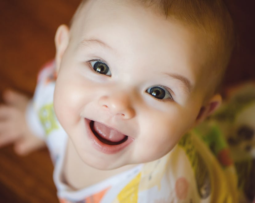 A baby looks up and smiles. There are lots of names to consider if you like benjamin but want someth...