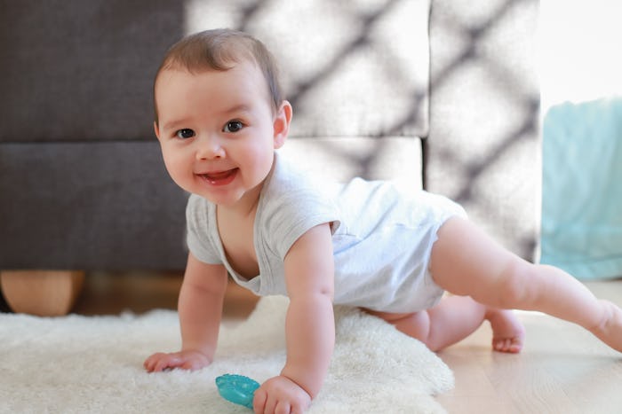 A baby girl props herself up on all fours. Mia is one of the most popular names in the U.S.