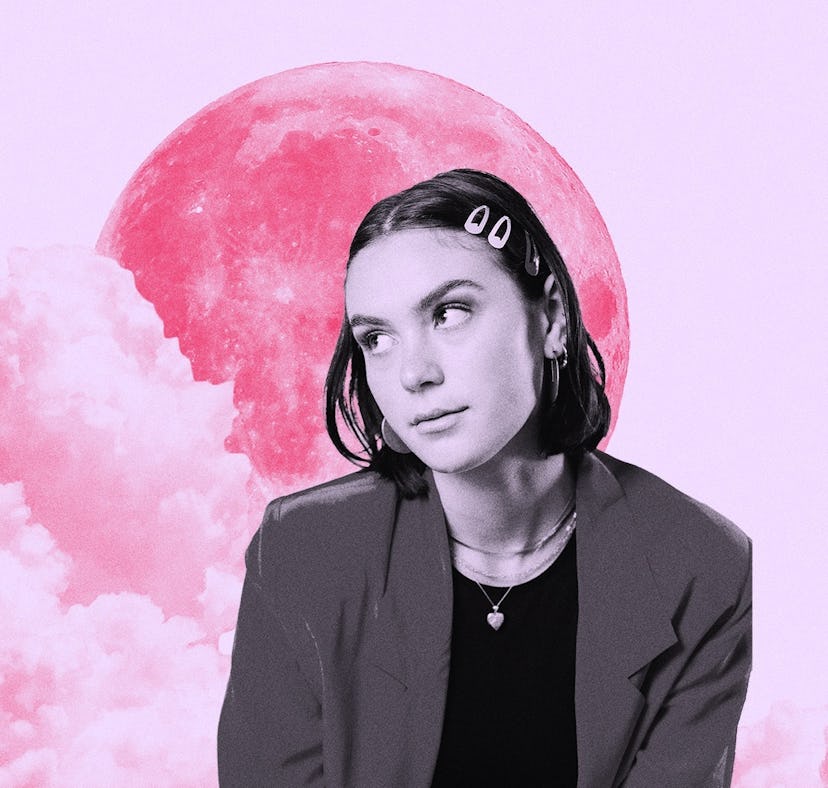Young woman in front of the moon after reading her July 2023 monthly horoscope.