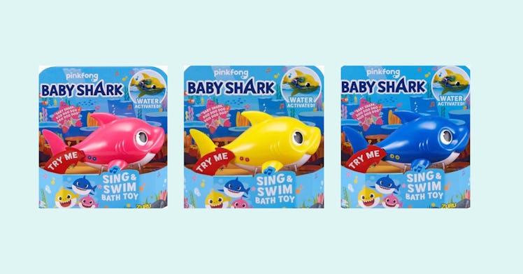 Three baby shark toys in their original packaging.