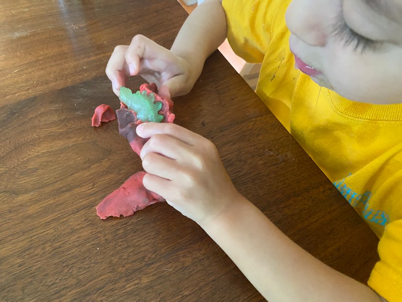 OT activity idea for toddlers: play dough and small toys 