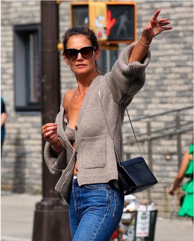 Katie Holmes wears a cashmere Khaite bralette and cardigan in New York City.