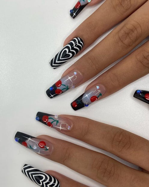 Here are the best design ideas for cherry nails. This manicure combines black French tips and white ...