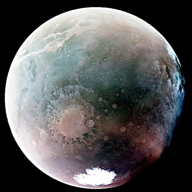 false color image of mars in shades of green, white, and tan on a black background