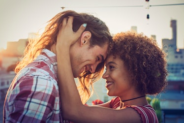 Man and woman touching foreheads and smiling on a romantic occassion