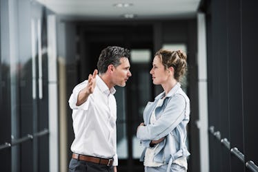 Stressed man talking to woman