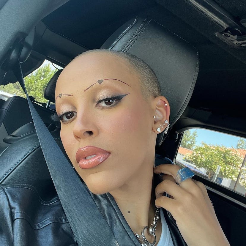 Doja Cat with a shaved head.