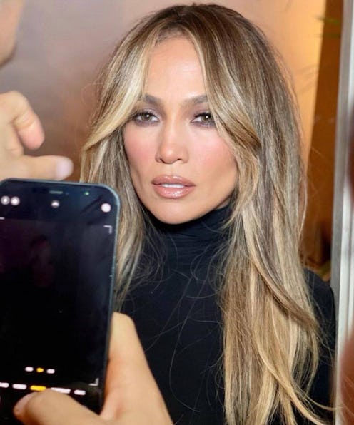 Jennifer Lopez with waterfall bangs, a layered haircut that has become a popular 2023 hair trend.