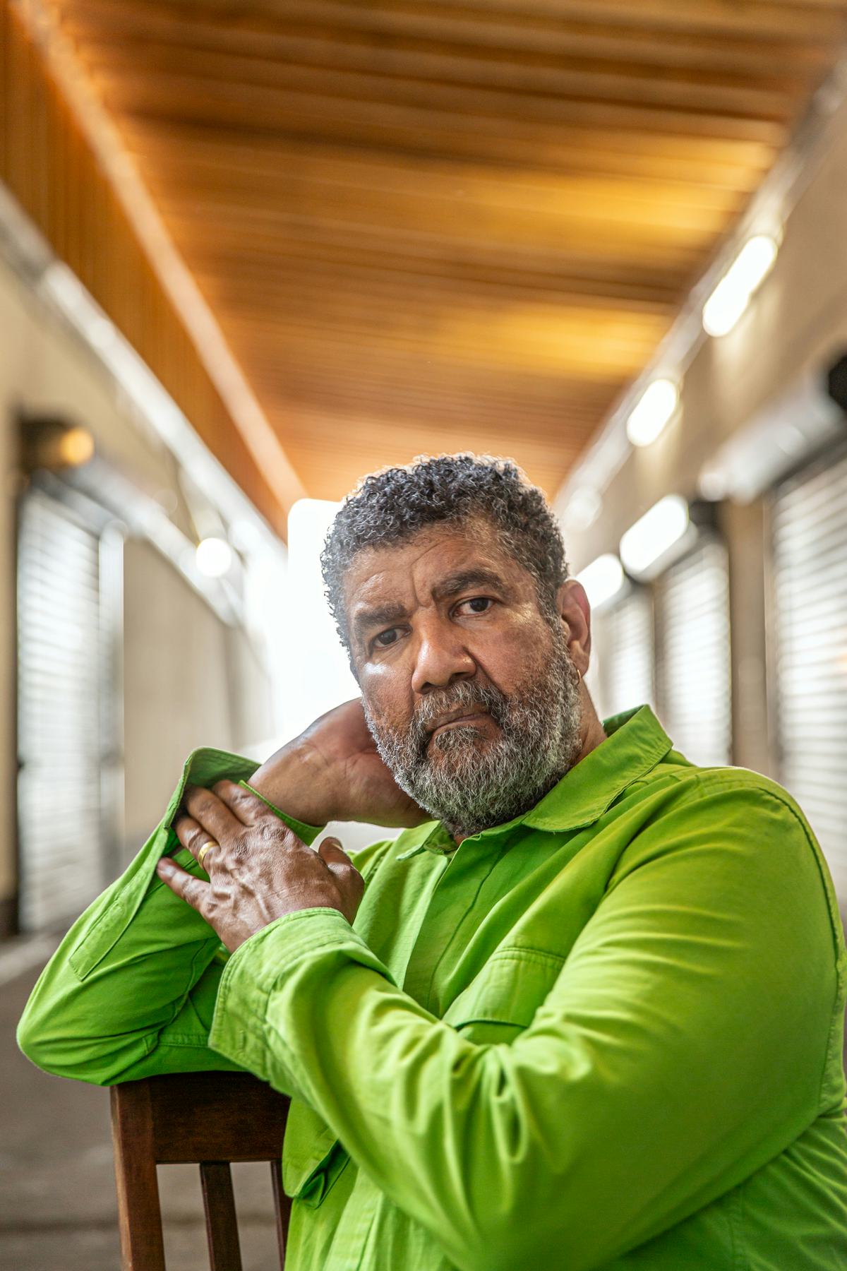 pepon osorio in a lime green button down shirt