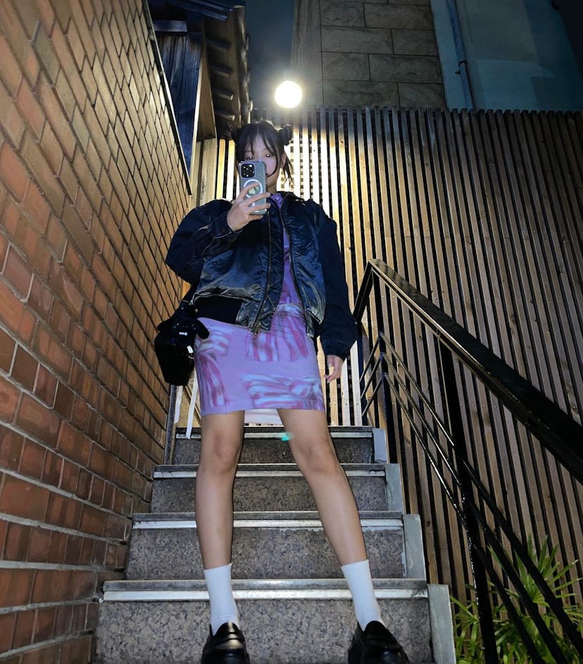 Jennie Kim wears a pink ribbon semi-sheer set from Acne Studios while in Tokyo, Japan.