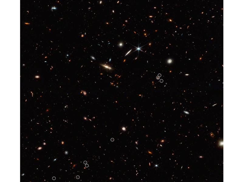 This view of the night sky is full of galaxies small and large. Along the middle of the image there ...
