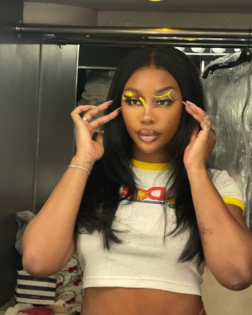 SZA yellow eye makeup and Dole shirt
