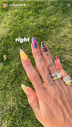 Hailey Bieber's mismatched nails are a masterclass in maximalist nail art.
