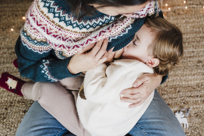Mother breastfeeding her child.