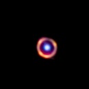 There is a ring with a sphere in the middle. The circle is light from a galaxy from only 1.5 billion...