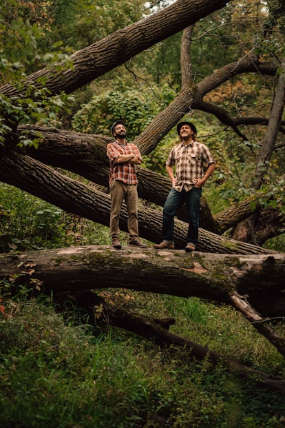The Okee Dokee Brothers in a forest.
