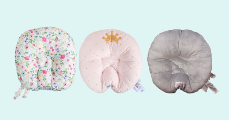 Three Boppy Newborn Loungers in different colors: patterned, pink, and grey.