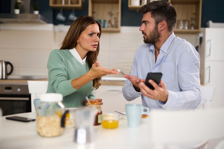 husband and wife arguing in the kitchen