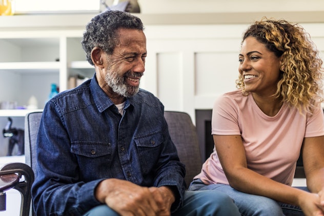 woman witting with grandfather in article about father's day messages