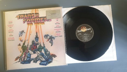 The original 1986 Transformers soundtrack: a multicolored record sleeve featuring the Transformers r...