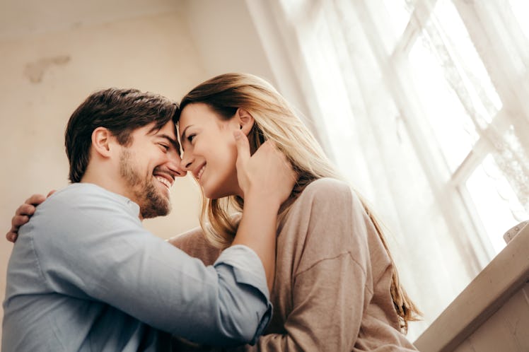 happy couple smiling and looking into one another's eyes