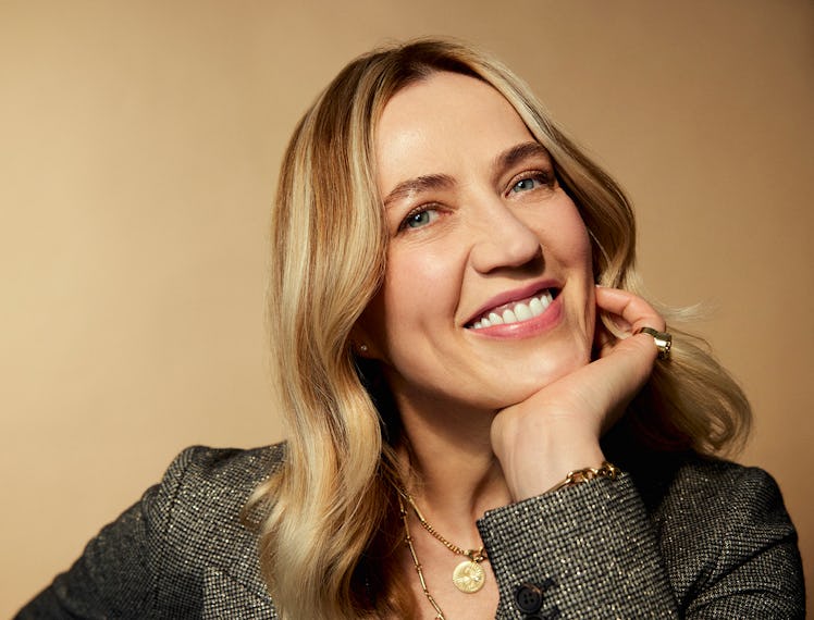 the aesthetician Danuta Mieloch. She's smiling at the camera with her chin in her hand and wearing a...