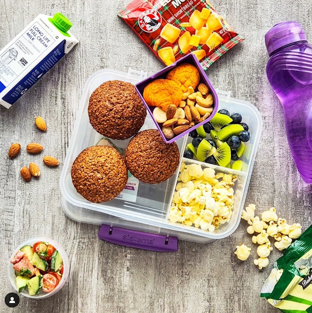 A bento box lunch with muffins and snacks in a story about school lunch ideas.