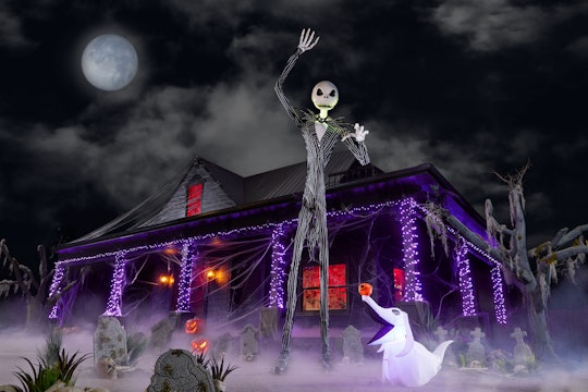 13-foot Jack Skellington inflatable from Home Depot stands in front of a haunted house set