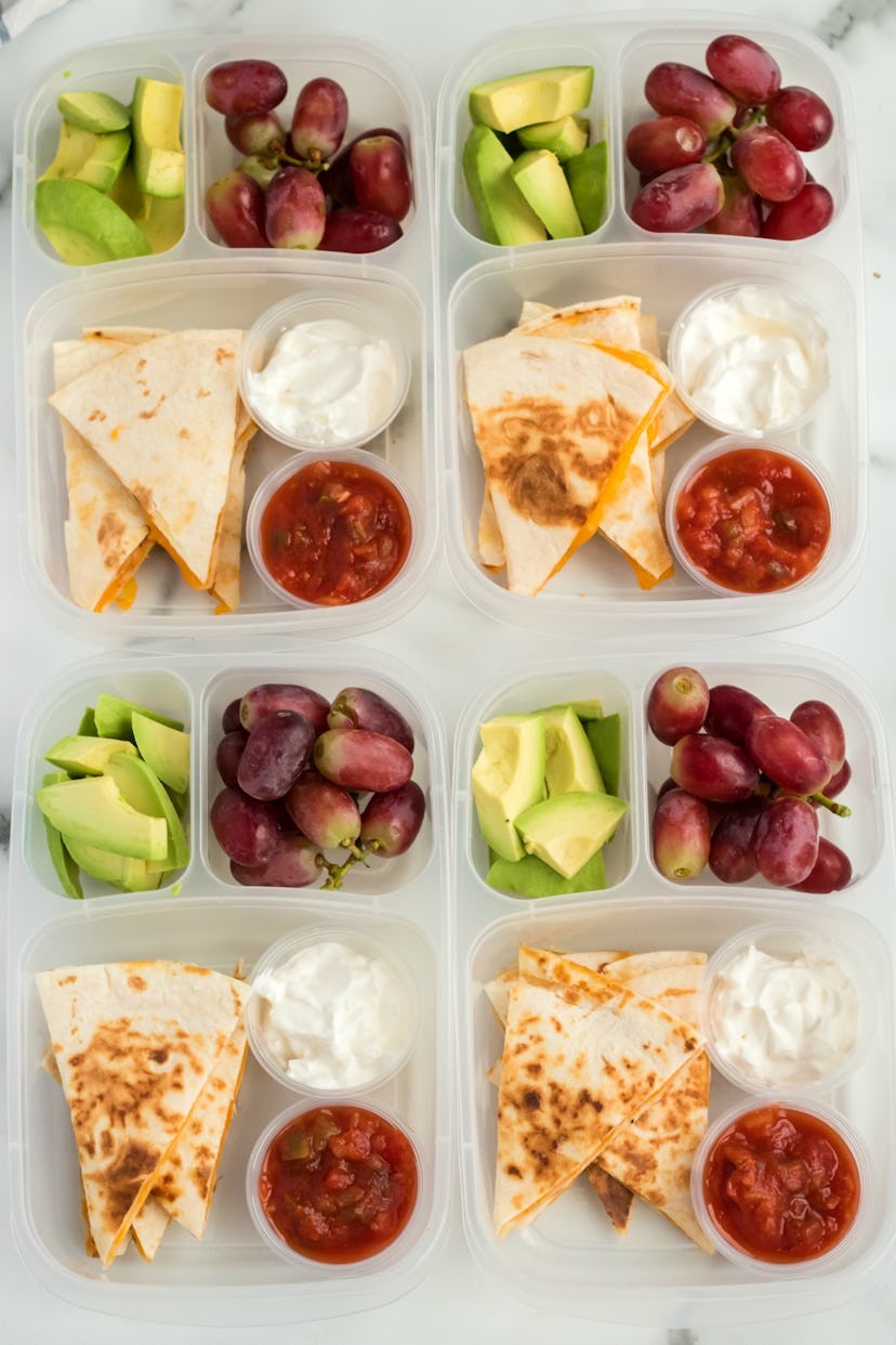 Quesadilla boxes with grapes, avocados, and dips, in a story about school lunch ideas.
