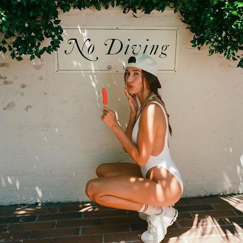 Hailey Bieber one piece swimsuit with popsicle