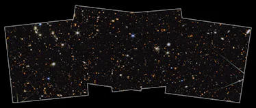 Galaxies are sprinkled throughout this image, some look like grand swirls, some have hazy tails, and...