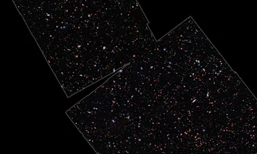 Galaxies of different sizes are visible throughout the middle portion of this image, the outer edges...