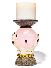 Bath & Body Works Halloween candle pedestal that looks like witch hands holding a crystal ball