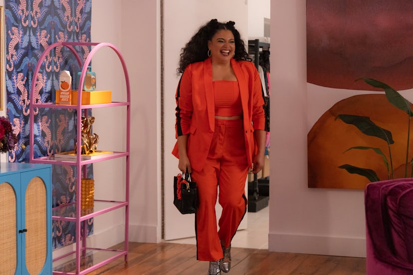 Michelle Buteau in an orange suit in 'Survival of the Thickest.'