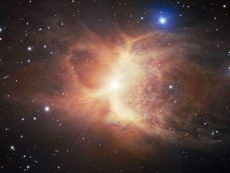 At the heart of a scene peppered with stars of different sizes, there is a glow that gets brighter a...