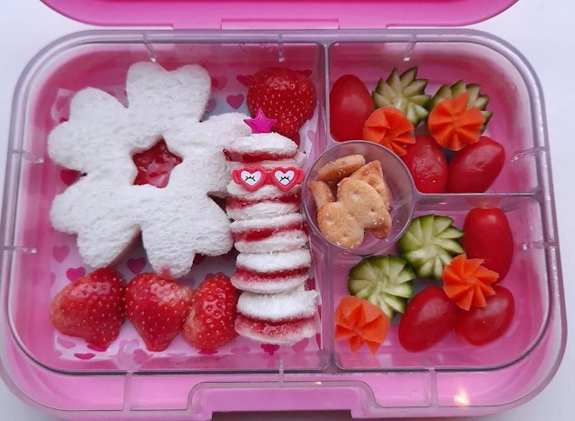 flower shaped jelly sandwich with strawberries, tomatoes and a mini sandwich skewer on the side; flo...