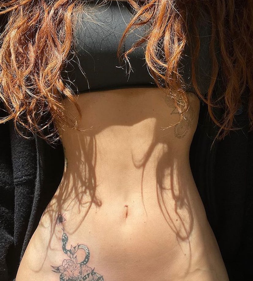 Megan Fox snake tattoo on pelvis 2023