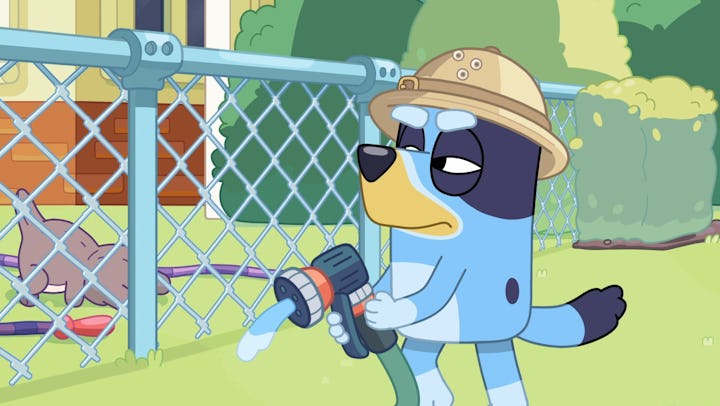 Bandit holding a hose in 'Bluey'