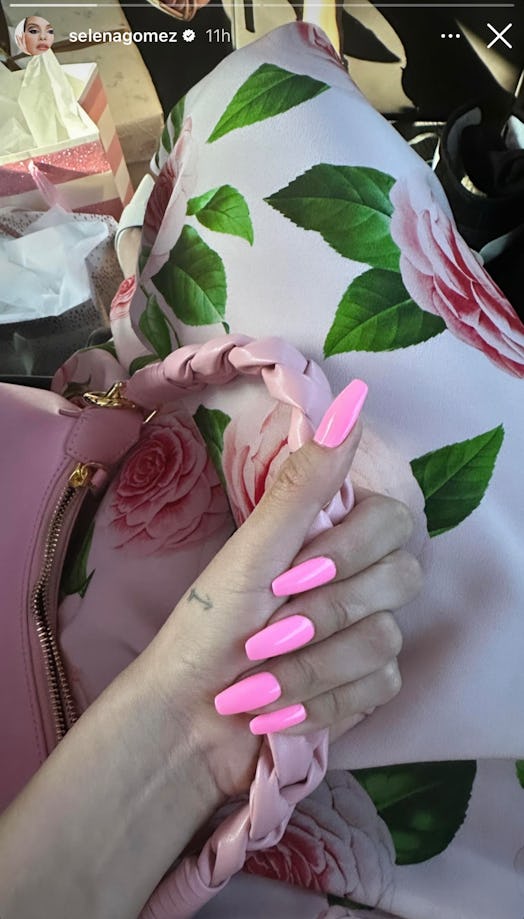 Selena Gomez's bubblegum pink Barbie nails and arrow hand tattoo.