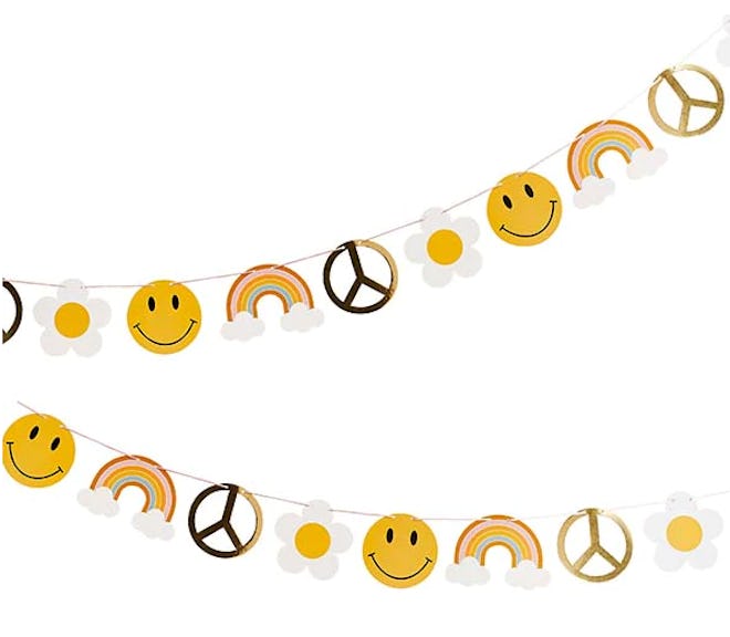 A garland of daisies, peace signs, and smiley faces for a 70s birthday party.