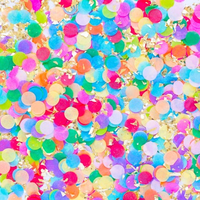 Rainbow confetti is a must have piece of rainbow birthday party decor.