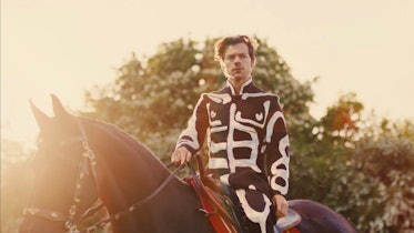 Harry Styles wears a black and white look during his "Daylight" music video