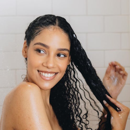 Here's how to use a scalp massager for boosting hair growth, with tips from a dermatologist.