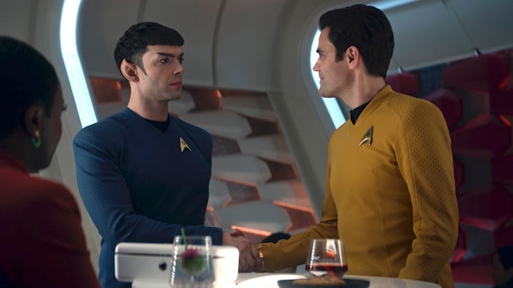 Ethan Peck as Spock shaking hands with Paul Wesley as Kirk in 'Star Trek: Strange New Worlds.'