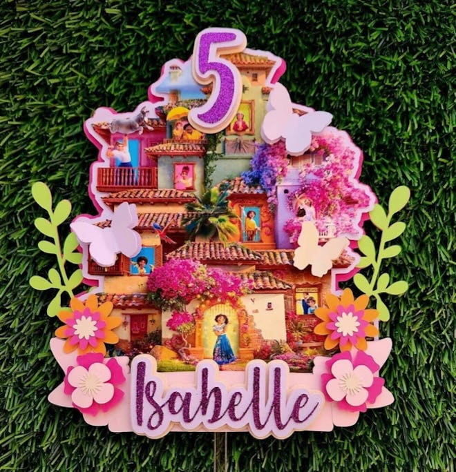 Mirabel Cake Topper, the perfect addition to any encanto birthday party decorations.