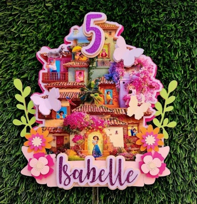 Mirabel Cake Topper, the perfect addition to any encanto birthday party decorations.
