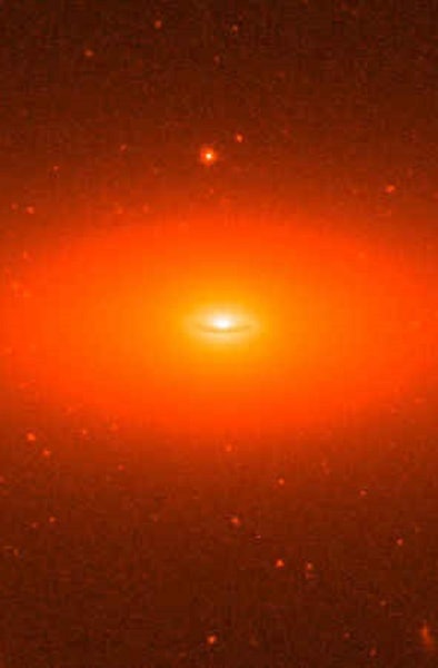 An oval-shaped galaxy, glowing in shades of red like a baleful giant eye